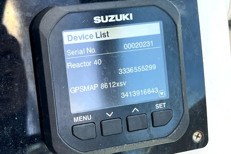 Slide: The Image of Suzuki device display on 2004 Century 3200 Walk-Around boat, showing serial and GPS information. - 98