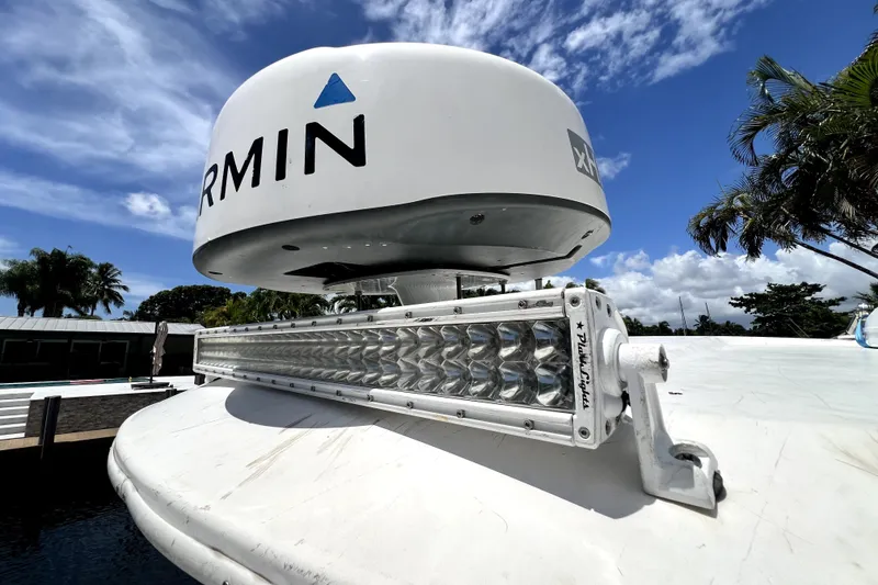 Slide: The Image of 2004 Century 3200 Walk-Around boat with Garmin radar and LED light bar. - 51