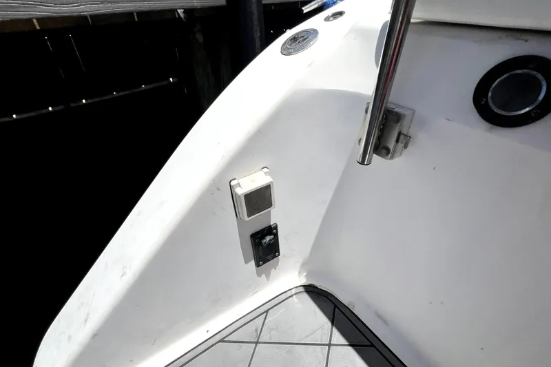 Slide: The Image of 2004 Century 3200 Walk-Around boat interior detail with railing and electrical outlet. - 31