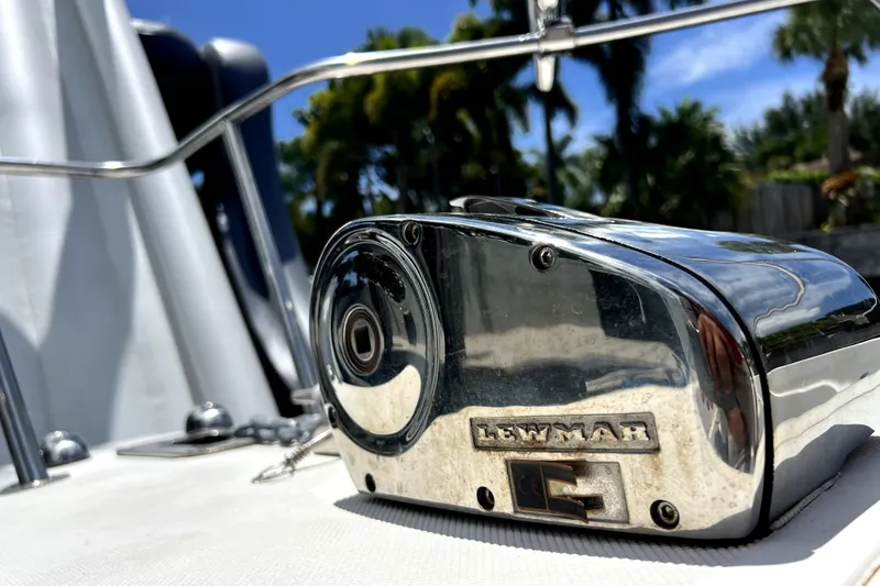 Slide: The Image of Chrome Lewmar winch on 2004 Century 3200 Walk-Around boat, with tropical background. - 53