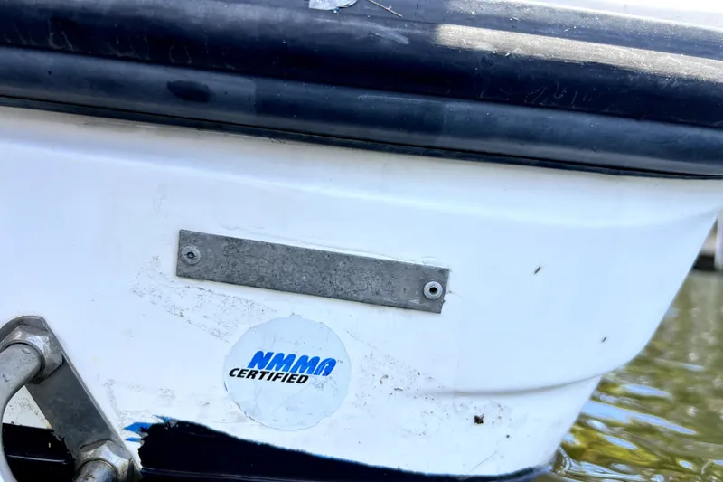 Slide: The Image of 2004 Century 3200 Walk-Around boat with NMMA certification sticker on the hull. - 80