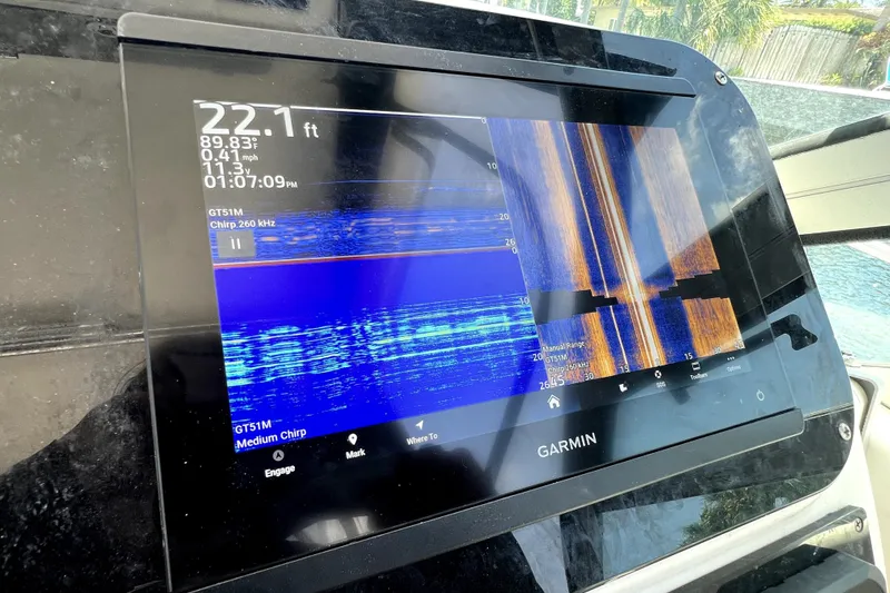 Slide: The Image of Garmin marine display on 2004 Century 3200 Walk-Around, showing sonar and navigation data. - 59