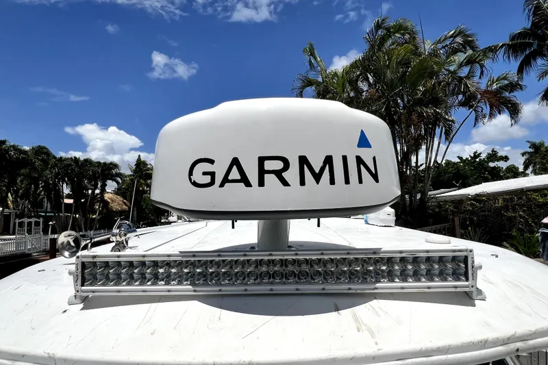 Slide: The Image of 2004 Century 3200 Walk-Around boat with Garmin radar and LED light bar. - 52