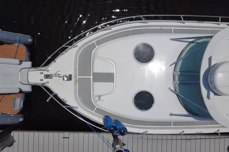 Slide: The Image of Top view of a 2004 Century 3200 Walk-Around boat docked at a marina. - 9