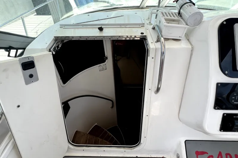 Slide: The Image of 2004 Century 3200 Walk-Around boat cabin entrance with stairs and handrail. - 99