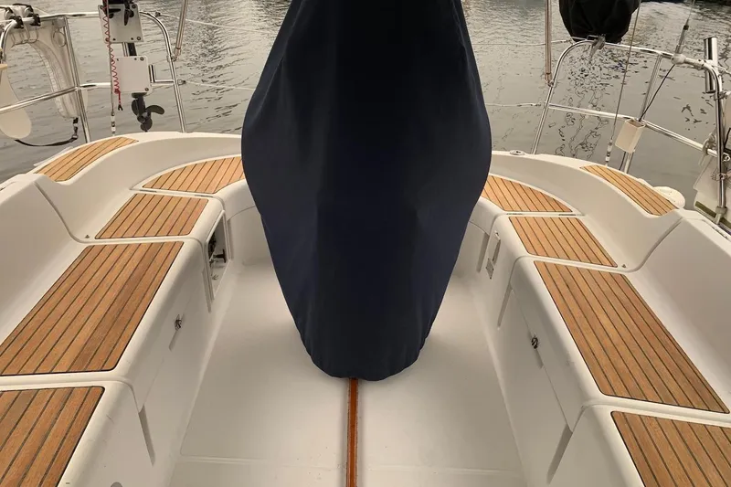 Slide: The Image of Cockpit of 2000 Jeanneau Sun Odyssey 37 sailboat with teak seating and covered helm. - 9