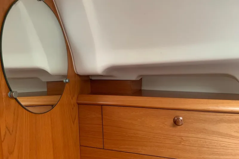 Slide: The Image of Interior of 2000 Jeanneau Sun Odyssey 37 yacht with wooden cabinetry and mirror. - 35