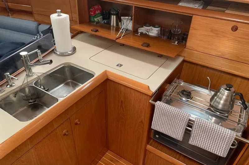 Slide: The Image of Galley kitchen in 2000 Jeanneau Sun Odyssey 37 sailboat with sink and stove. - 28