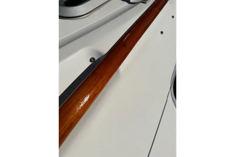 Slide: The Image of Close-up of Jeanneau Sun Odyssey 36.2 yacht's polished wooden handrail, 2000 model. - 21