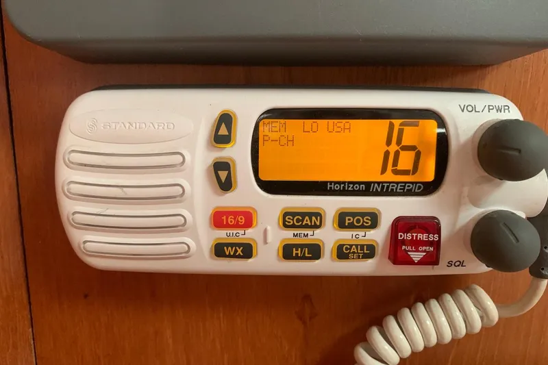 Slide: The Image of VHF marine radio on Jeanneau Sun Odyssey 37, displaying channel 16. - 44