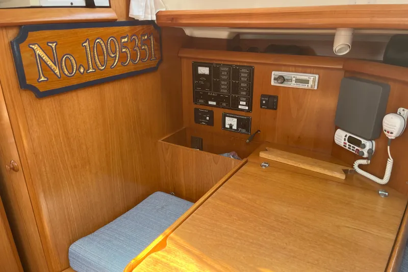 Slide: The Image of Interior of 2000 Jeanneau Sun Odyssey 36.2 sailboat with control panel and seating area. - 30