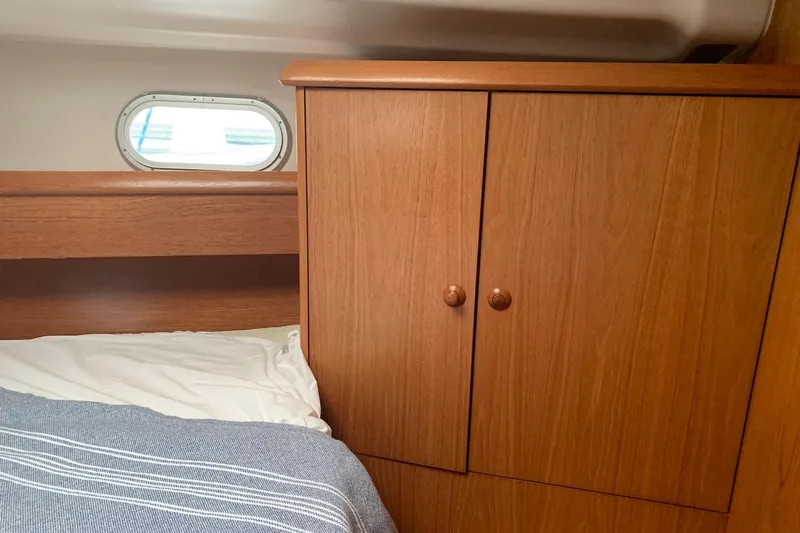 Slide: The Image of Interior cabin of 2000 Jeanneau Sun Odyssey 37 with wooden wardrobe and bed. - 34