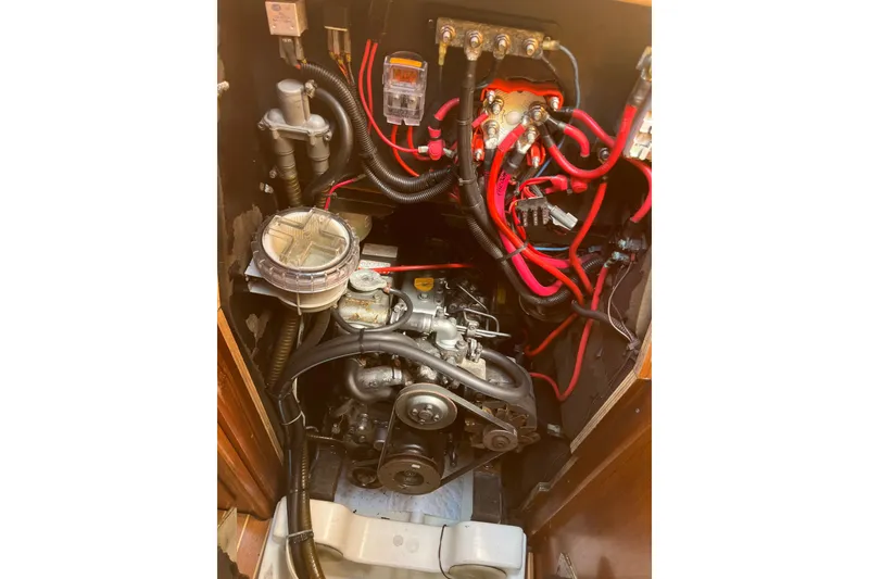 Slide: The Image of Engine compartment of a 2000 Jeanneau Sun Odyssey 36.2 sailboat, showcasing wiring and components. - 42