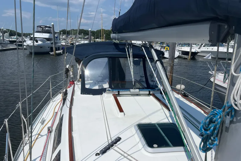 Slide: The Image of Jeanneau Sun Odyssey 36.2 sailboat, 2000 model, docked in a marina under clear skies. - 1