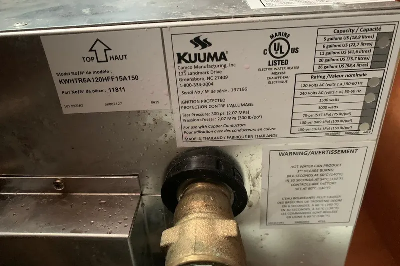 Slide: The Image of Kuuma electric water heater label on Jeanneau Sun Odyssey 37, 2000 model. - 38