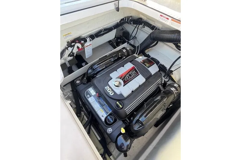 Slide: The Image of 2016 Bayliner VR5 Bowrider I/O engine compartment with 4.5L 200 HP engine. - 9