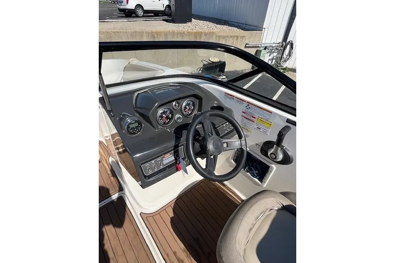 Slide: The Image of 2016 Bayliner VR5 Bowrider I/O dashboard with steering wheel and gauges. - 17