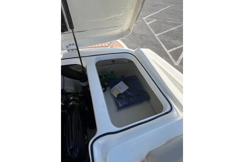 Slide: The Image of Open storage compartment in 2016 Bayliner VR5 Bowrider I/O boat. - 10