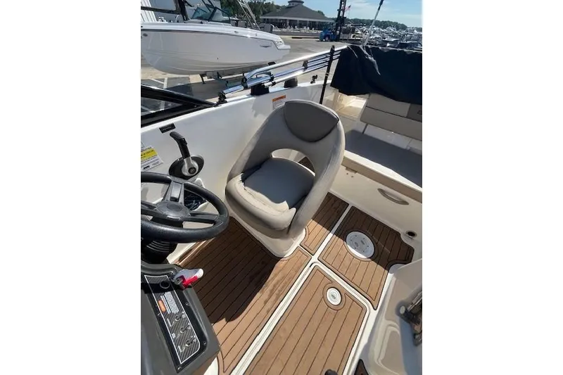 Slide: The Image of 2016 Bayliner VR5 Bowrider I/O interior with steering wheel and cushioned seat. - 12