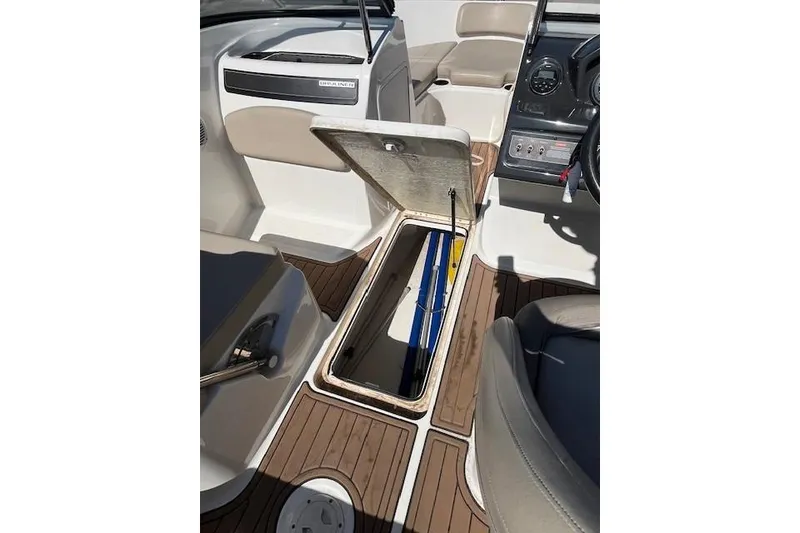 Slide: The Image of 2016 Bayliner VR5 Bowrider I/O interior with open storage compartment and seating. - 13