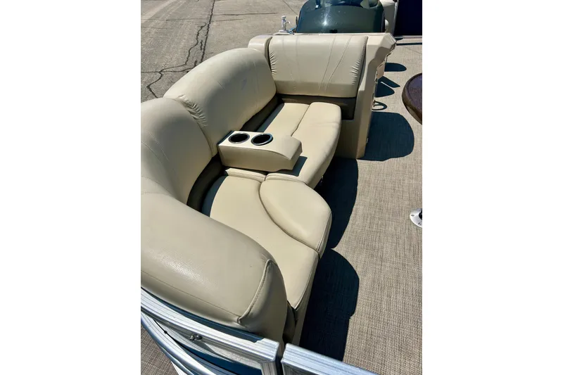 Slide: The Image of Beige seating on 2017 Starcraft CX 23 RE pontoon boat with cup holders. - 9