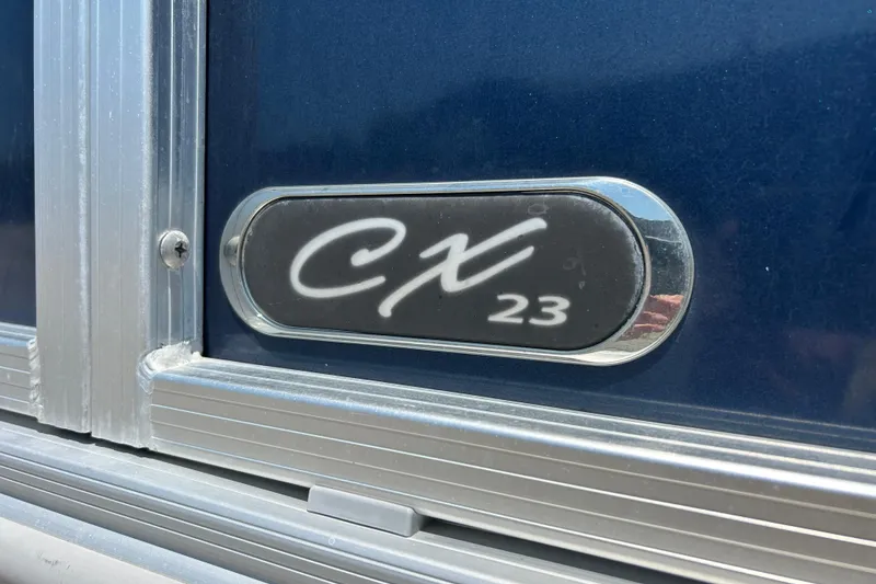 Slide: The Image of 2017 Starcraft CX 23 RE emblem on blue background with metallic trim. - 6