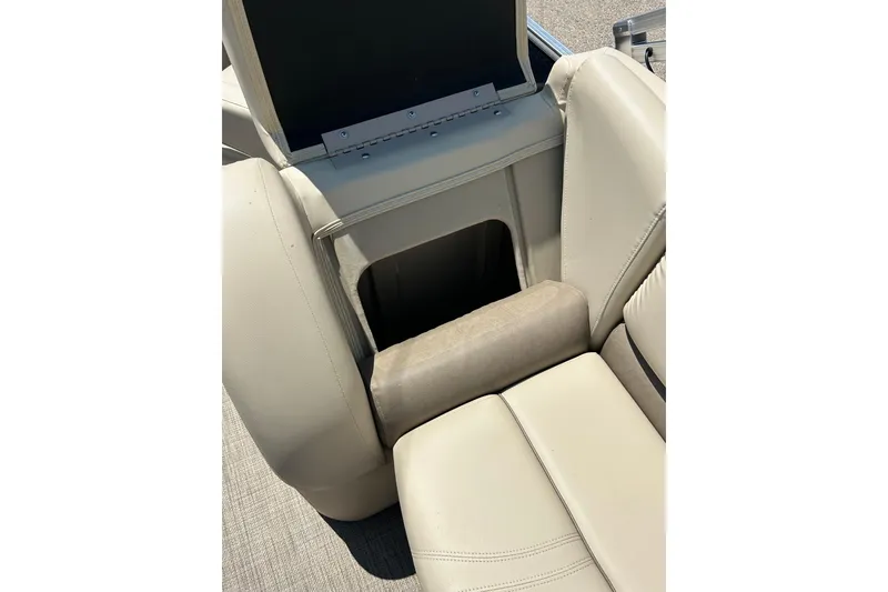 Slide: The Image of 2017 Starcraft CX 23 RE boat seat with storage compartment open. - 38