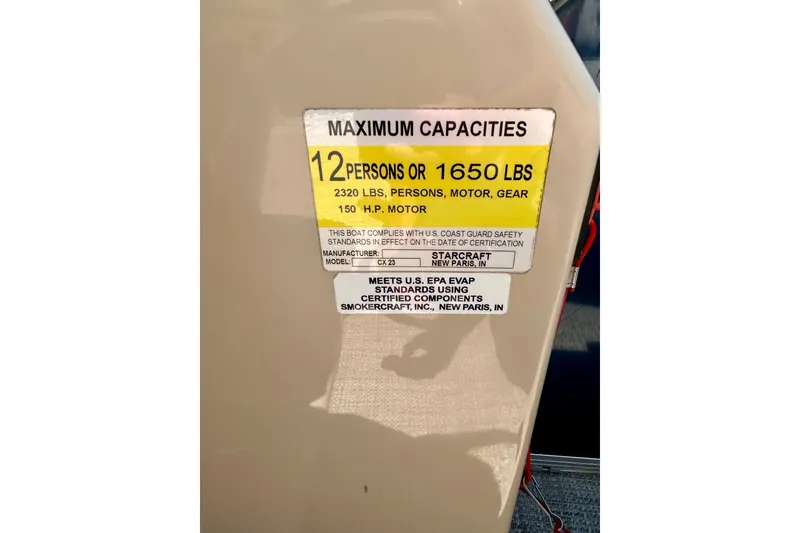 Slide: The Image of Capacity label on 2017 Starcraft CX 23 RE boat, max 12 persons or 1650 lbs. - 28