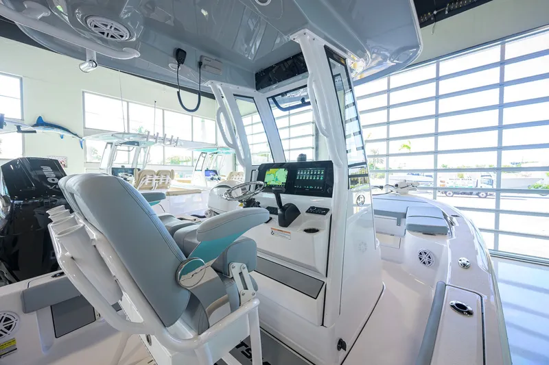 Slide: The Image of 2027 Sportsman Masters 227 Bay Boat interior with modern helm and seating. - 28