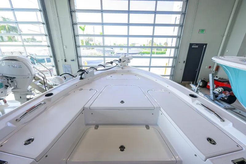 Slide: The Image of 2027 Sportsman Masters 227 Bay Boat interior, showcasing spacious deck and storage compartments. - 19