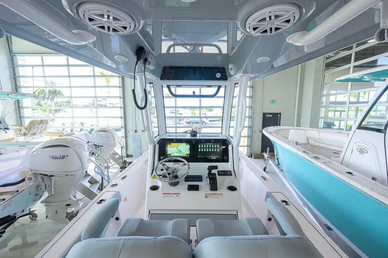Slide: The Image of Interior view of 2027 Sportsman Masters 227 Bay Boat with modern dashboard and controls. - 7