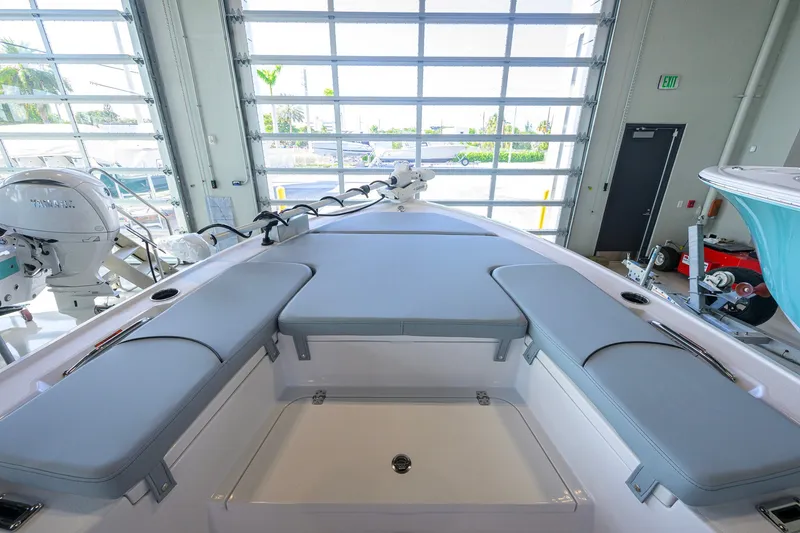 Slide: The Image of 2027 Sportsman Masters 227 Bay Boat interior with cushioned seating and modern design. - 13