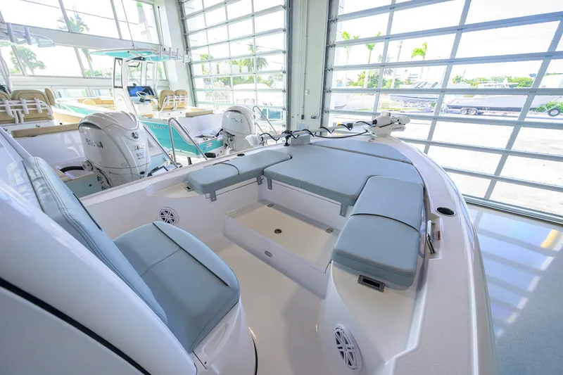 Slide: The Image of 2027 Sportsman Masters 227 Bay Boat interior with cushioned seating and modern design. - 14