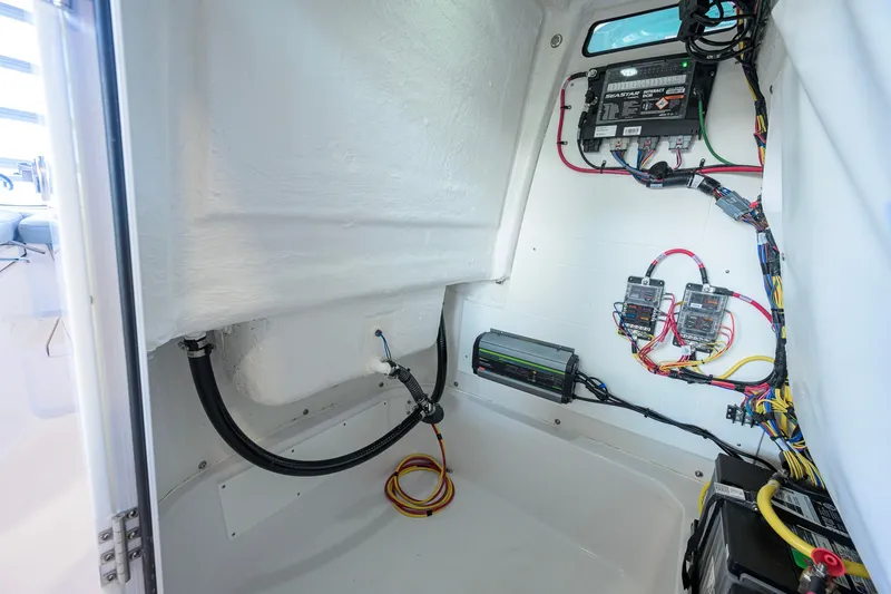 Slide: The Image of Interior wiring of 2027 Sportsman Masters 227 Bay Boat, showcasing electrical components and connections. - 44