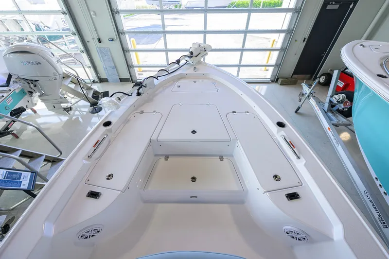 Slide: The Image of 2027 Sportsman Masters 227 Bay Boat interior with storage compartments and Yamaha engine. - 16