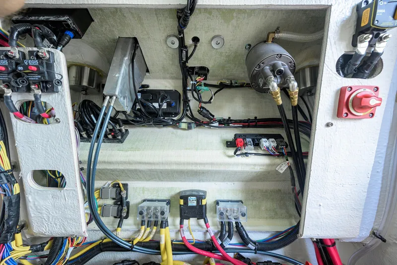Slide: The Image of Electrical wiring and components inside a 2027 Sportsman Masters 227 Bay Boat. - 48