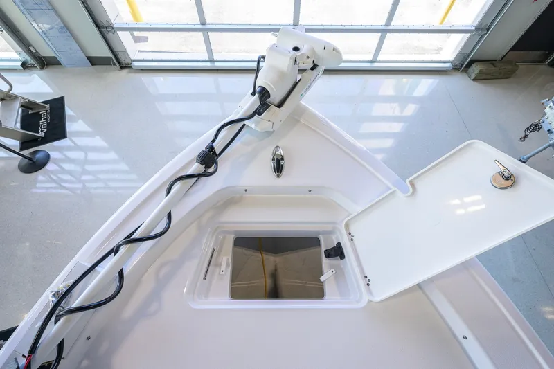 Slide: The Image of 2027 Sportsman Masters 227 Bay Boat interior with open hatch and mounted equipment. - 20