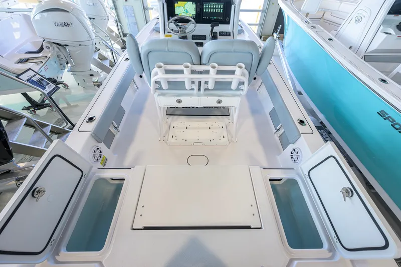 Slide: The Image of 2027 Sportsman Masters 227 Bay Boat interior with dual seats and storage compartments. - 34