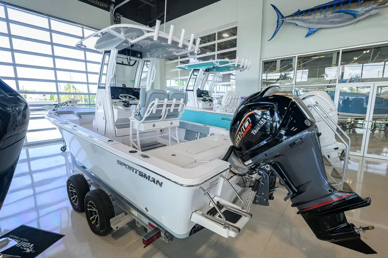 Slide: The Image of 2027 Sportsman Masters 227 Bay Boat in showroom, featuring Yamaha outboard motor. - 3