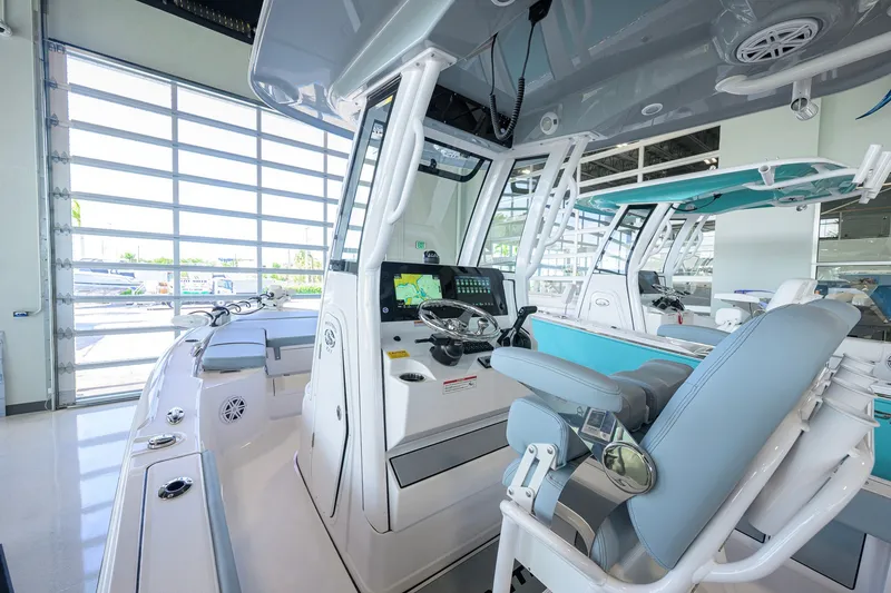 Slide: The Image of 2027 Sportsman Masters 227 Bay Boat interior with modern controls and seating. - 6