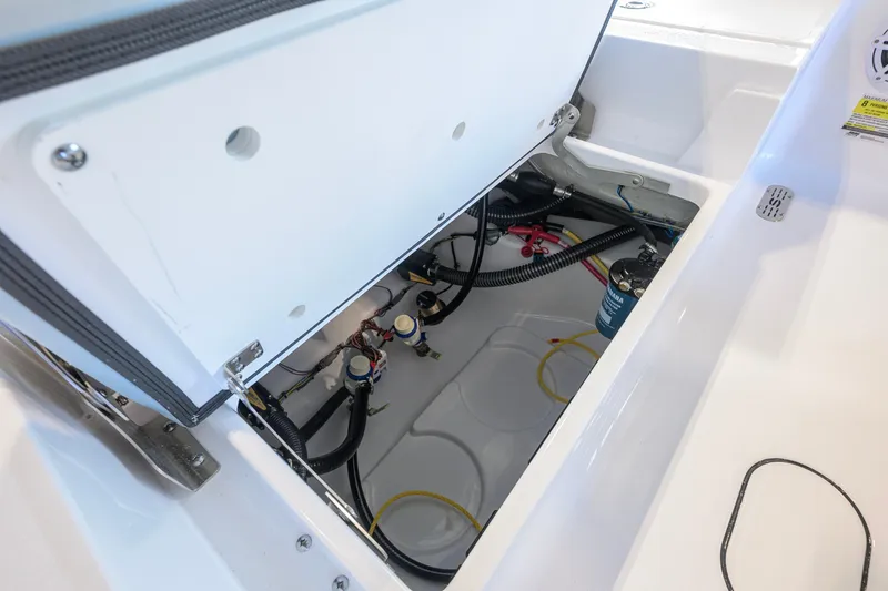 Slide: The Image of Open hatch of 2027 Sportsman Masters 227 Bay Boat showing internal wiring and components. - 40