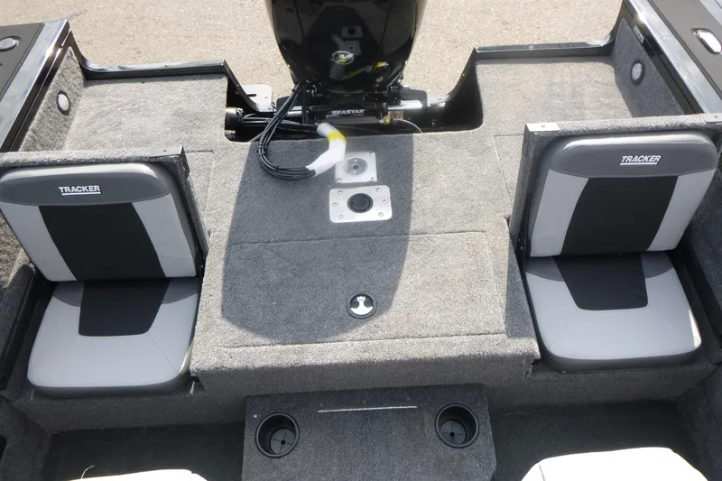 Slide: The Image of 2027 Tracker Targa V-18 Combo boat interior with dual seats and motor. - 14