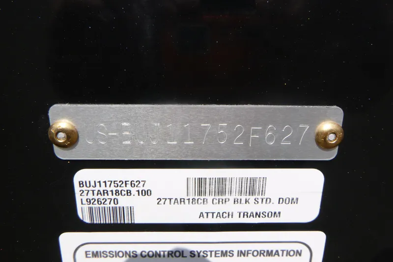 Slide: The Image of 2027 Tracker Targa V-18 Combo serial number plate with emissions control information. - 19