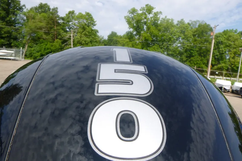 Slide: The Image of Close-up of a Tracker Targa V-18 Combo 2027 boat engine with "150" decal. - 17
