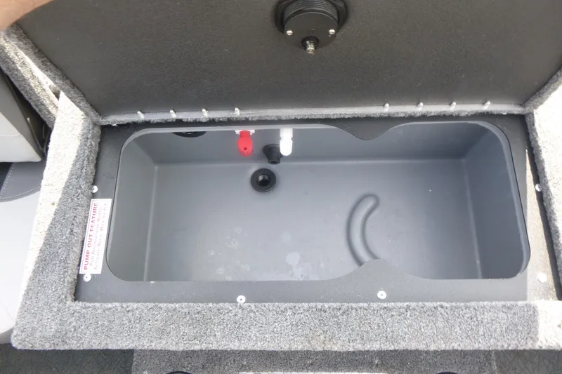 Slide: The Image of Livewell compartment in a 2027 Tracker Targa V-18 Combo boat, featuring pump-out feature. - 15