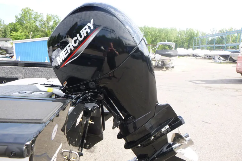 Slide: The Image of Mercury outboard motor on 2027 Tracker Targa V-18 Combo boat, parked outdoors. - 16