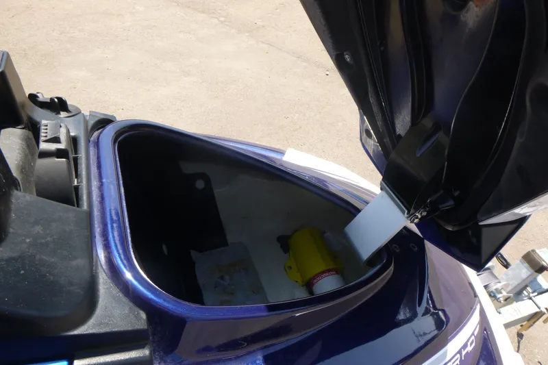 Slide: The Image of Open storage compartment of 2020 Yamaha WaveRunner VX Cruiser HO with visible safety equipment. - 6