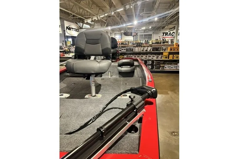 The Image of 2026 Tracker Pro Crappie 175 boat interior with seating and equipment in showroom. - 1