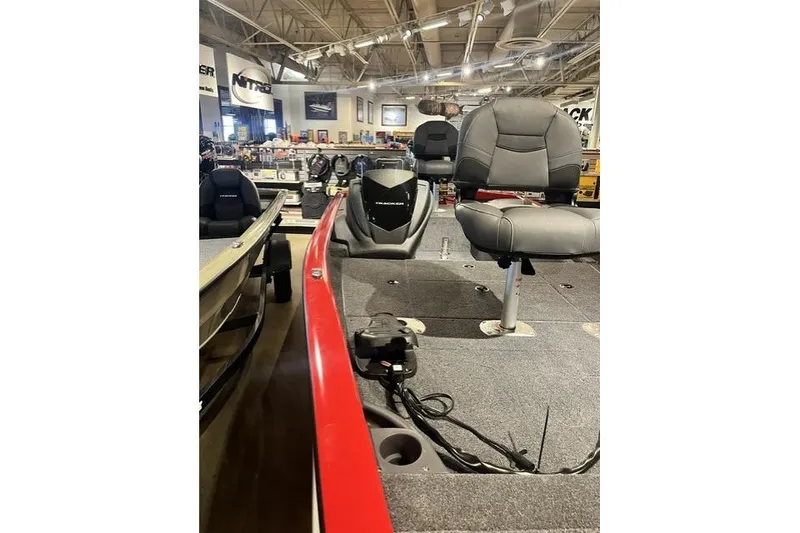 Slide: The Image of 2026 Tracker Pro Crappie 175 boat interior with seating and equipment in showroom. - 9