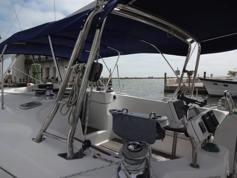 Slide: The Image of The image shows the cockpit of a 2009 Hunter 50 with blue sunshades and a steering wheel. - 3